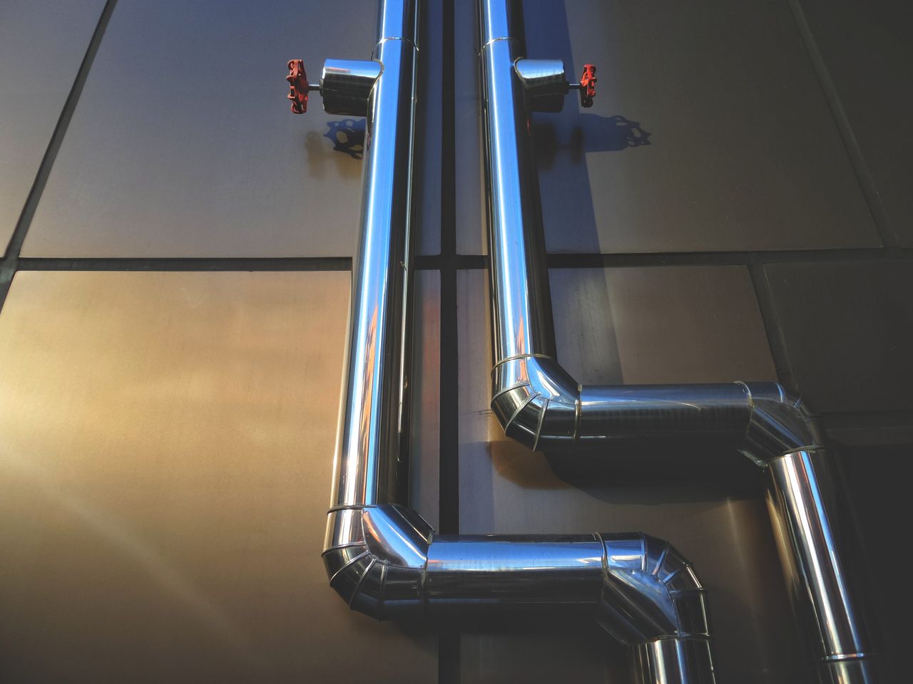 Crafting Captivating Headlines: Your awesome post title goes here Close-up view of industrial steel pipes with valves on a metallic background, showcasing architecture.